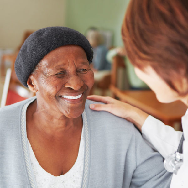 Two women smiling at each other